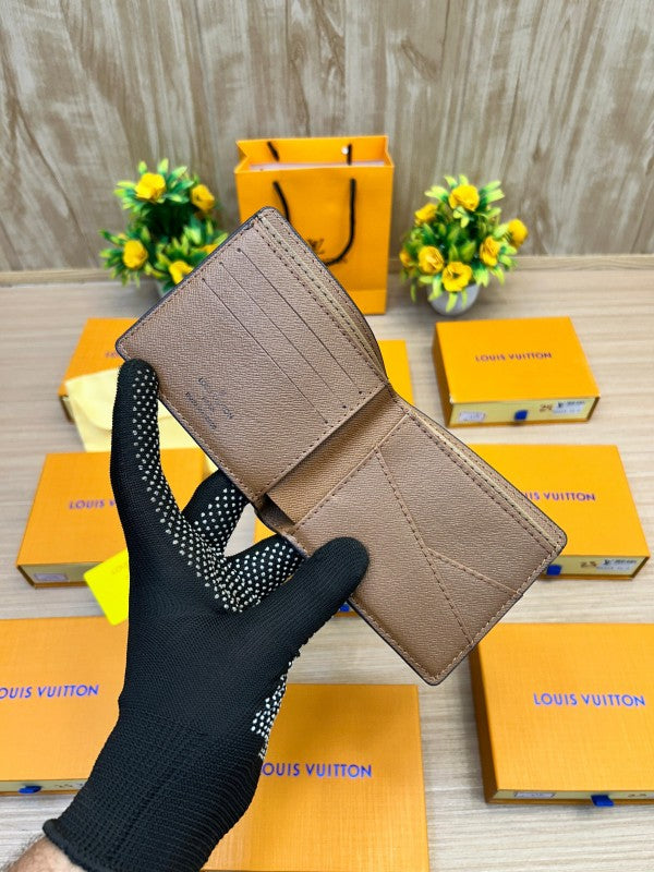 Louis Vuitton Taiga Leather Bi-Fold Wallet – Classic Brown